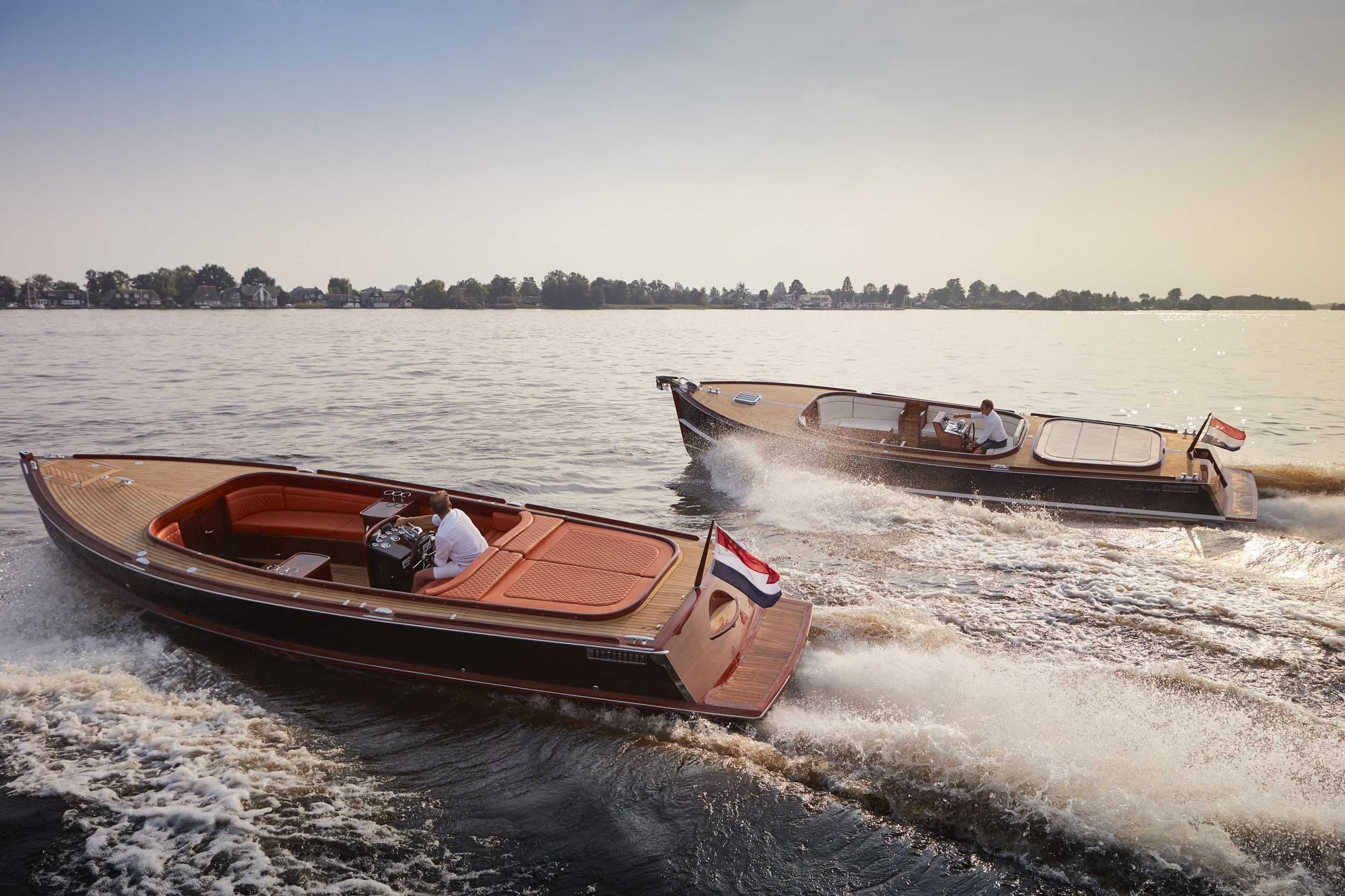 Twee Brandaris Barkas tenders op stil water